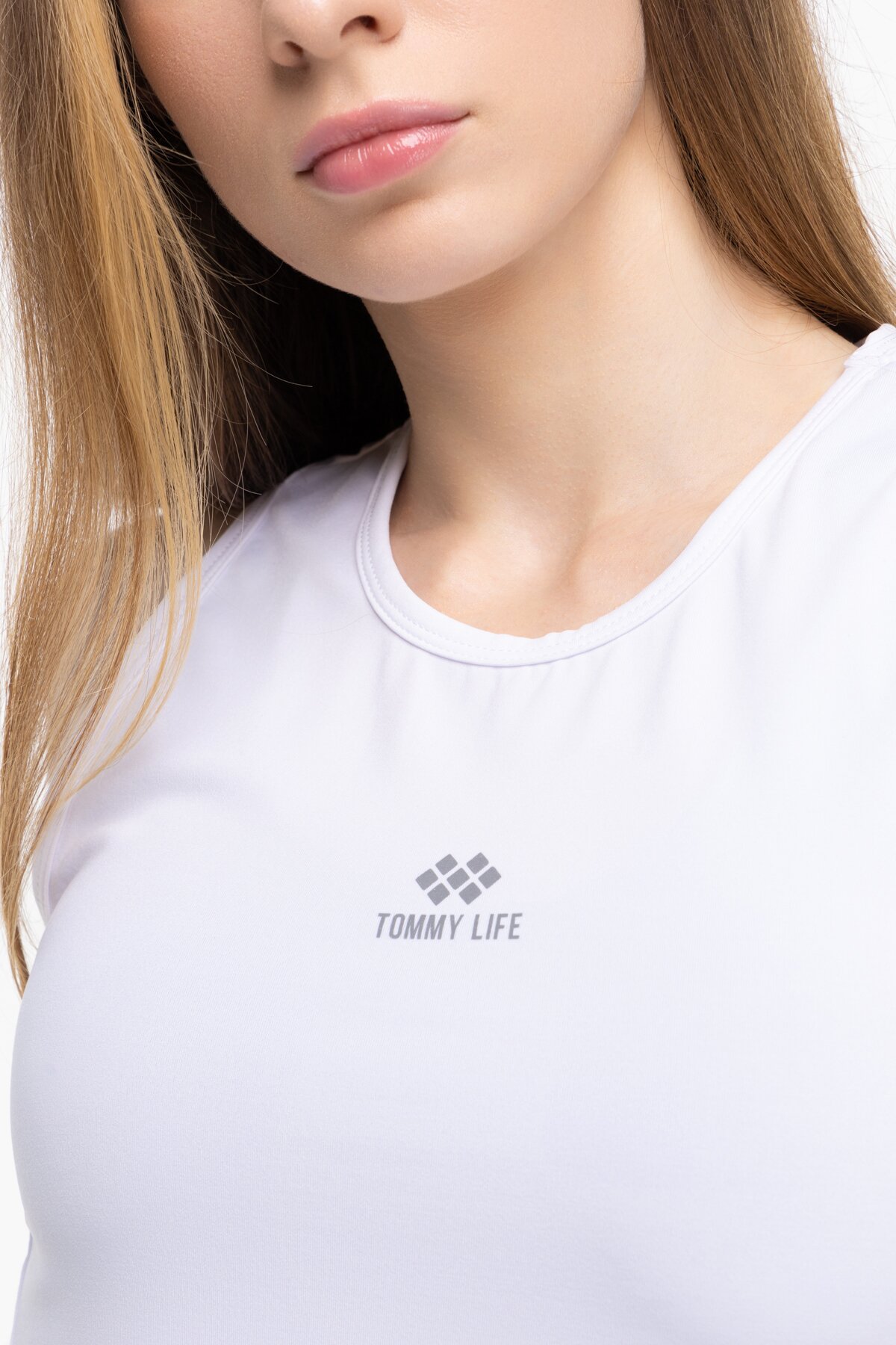 Майка фітнес однотонна жіноча Tommy life 97256 M Білий (2000989642374A)  Фото №1